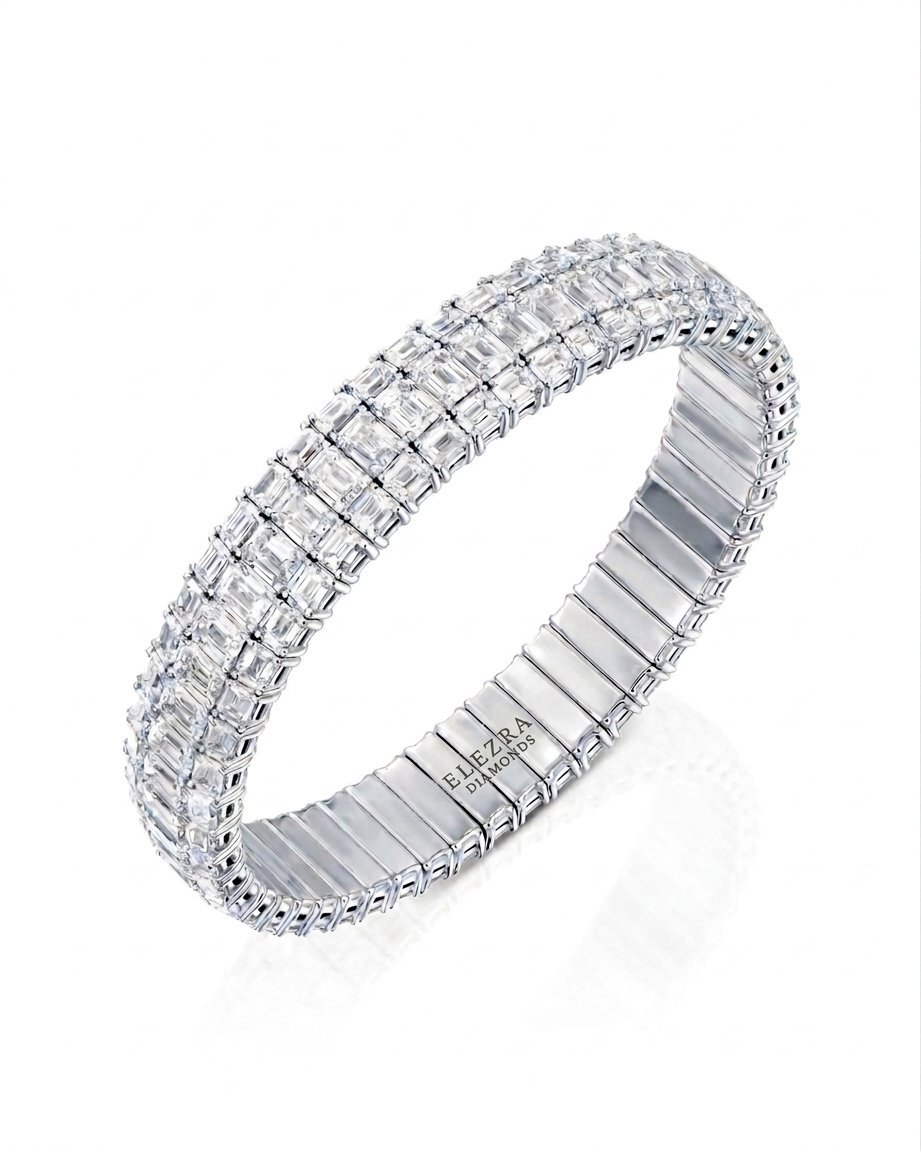 26.84CT EMERALD CUT DIAMONDS WIDE STRETCH BRACELET | 37.7G 18K WHITE GOLD
