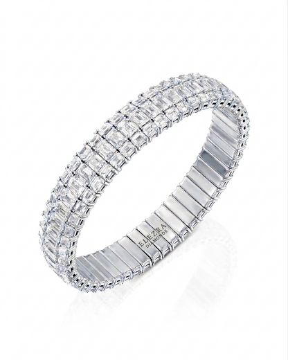26.84CT EMERALD CUT DIAMONDS WIDE STRETCH BRACELET | 37.7G 18K WHITE GOLD